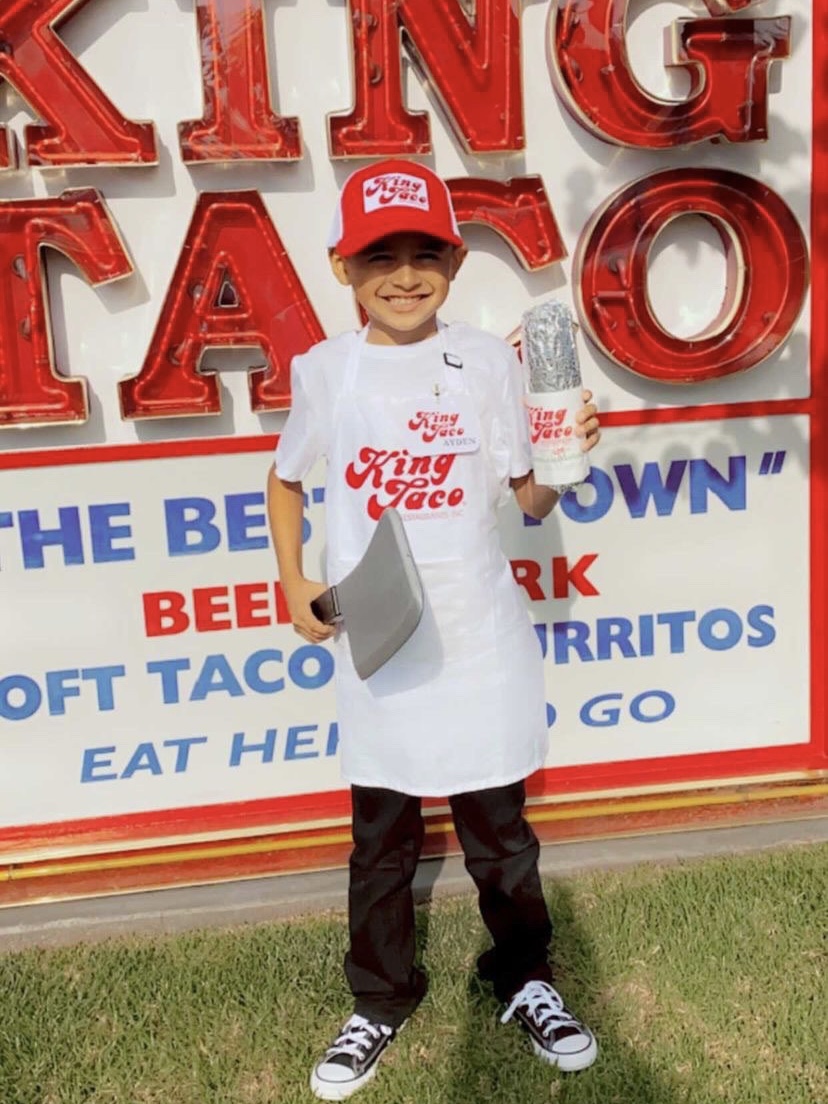 Young child dressed up as King Taco
